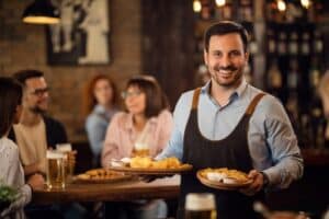 waiter carrying french fries